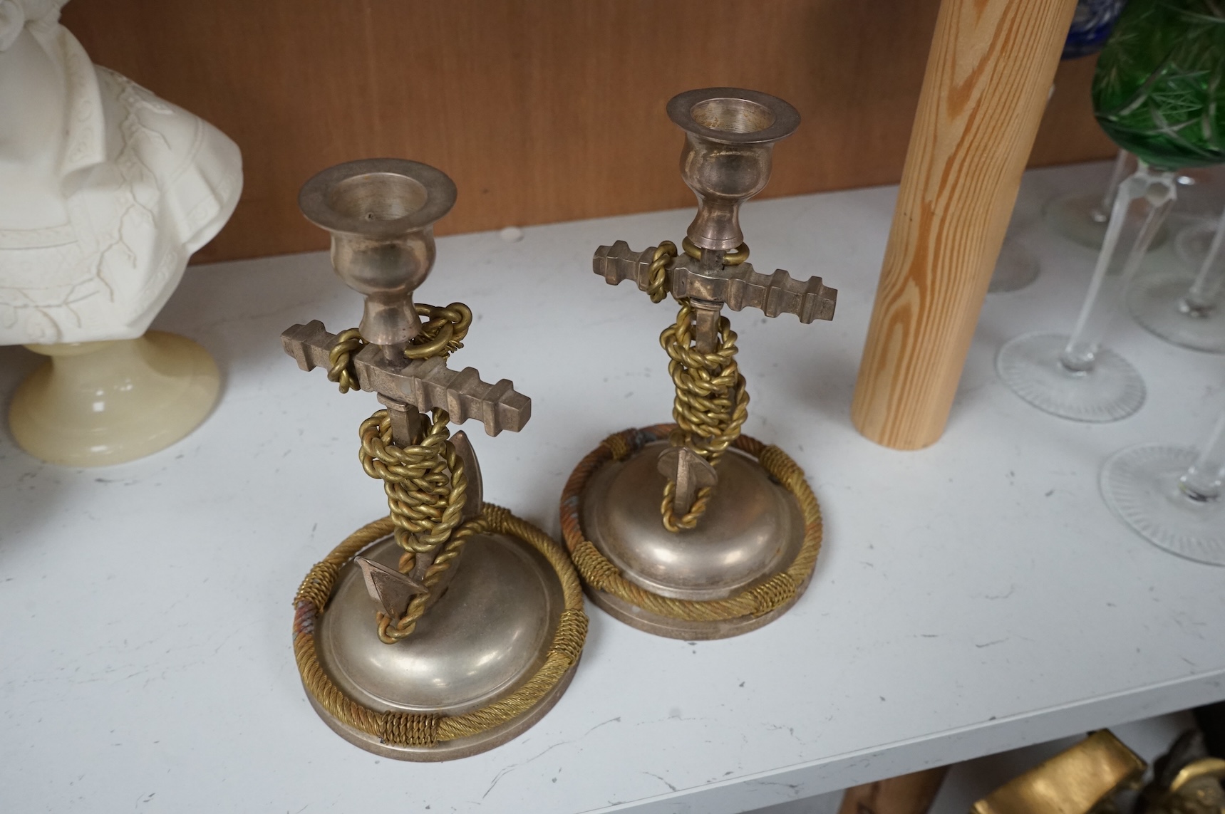 A pair of silver plated and part gilded anchor candlesticks, 18cm high.